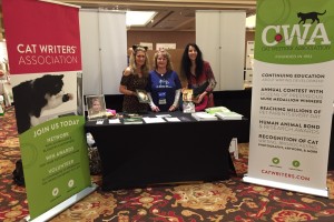 L-R: Deb Barnes, CWA President Marci Kladnik and Janiss Garza at the CWA Booth at the BlogPaws conference.