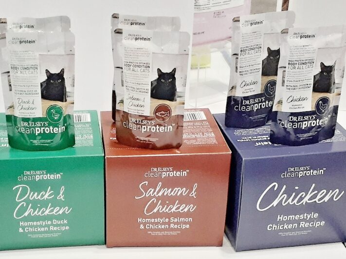 Doctor Elsey’s Clean Protein pouches of cat food in three flavors: green-label Duck and Chicken; maroon-label Salmon and Chicken; and purple-label Chicken.