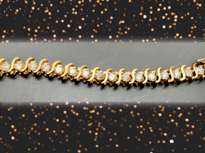 A gold and diamond bracelet.