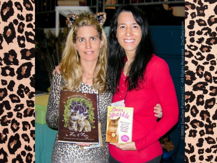 Deb and Janis Garza holding their books.