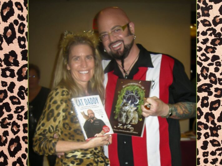 Deb and celebrity cat behaviorist Jackson Galaxy holding their books.