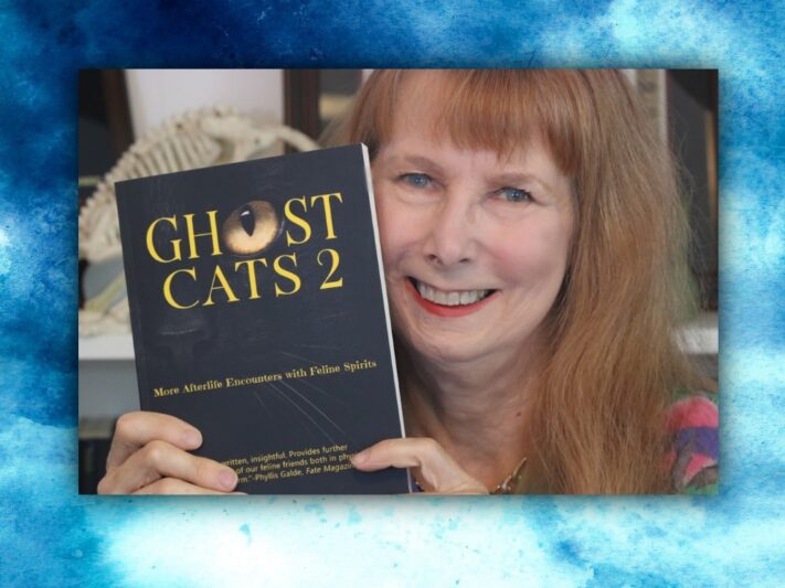 Dusty Rainbolt - woman holding "Ghost Cats 2" book