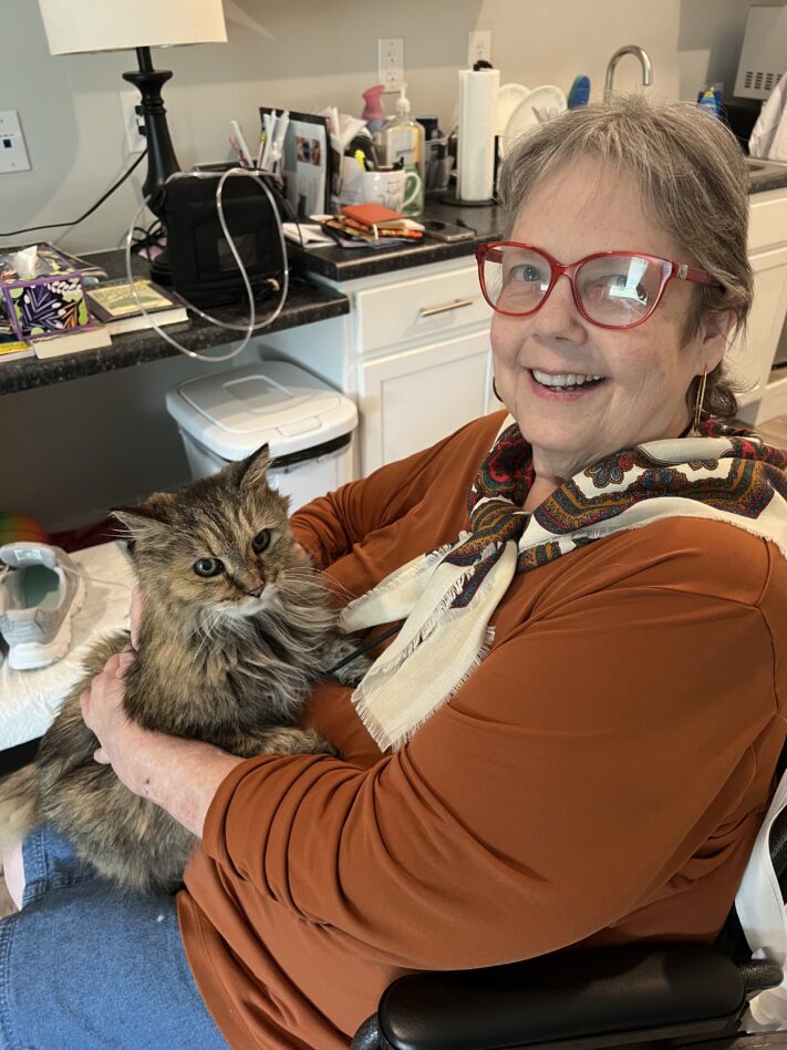 woman holding cat in lap