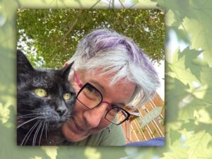 Karen G. Anderson with black cat Toby