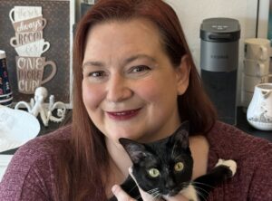 Writer Amber Royer with tuxedo cat